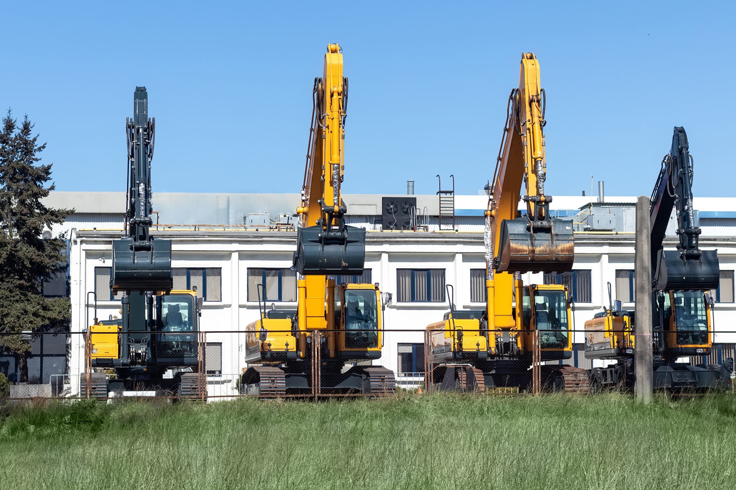 Four new modern excavators diggers with buckets o 2025 02 10 11 34 32 utc scaled 1