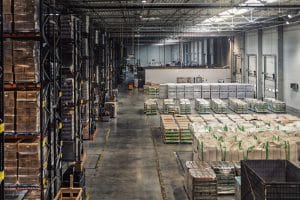 Huge distribution warehouse with high shelves vie 2024 10 31 01 43 55 utc scaled