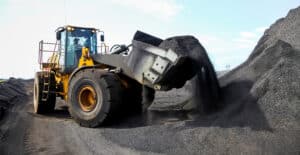 Large yellow loader moving black material at works 2026 03 18 16 05 44 utc